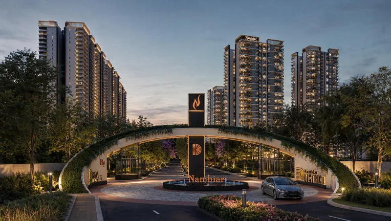 District 25 arched entrance gate with Nambiar signage at dusk
