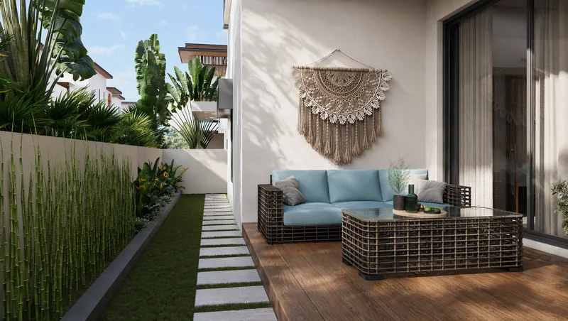 Villa courtyard with wicker sofa, timber deck and bamboo planting